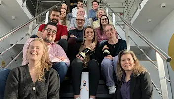 Mona Lisa Studio team members on staircase