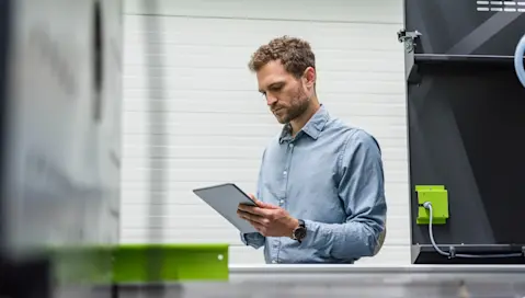 Businessman in manufacturing plant