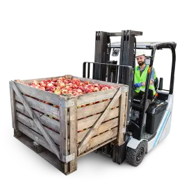 Forklift moving crate of fruit