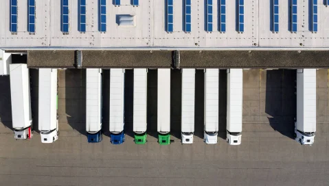 aerial view of row of semitrucks