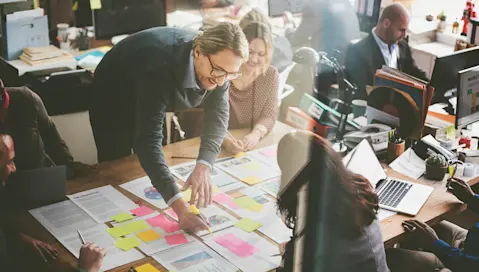 A group of people planning in a business setting.