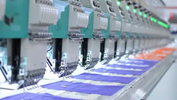 Industrial sewing machines in a manufacturing facility