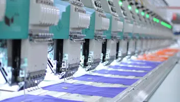 Industrial sewing machines in a manufacturing facility