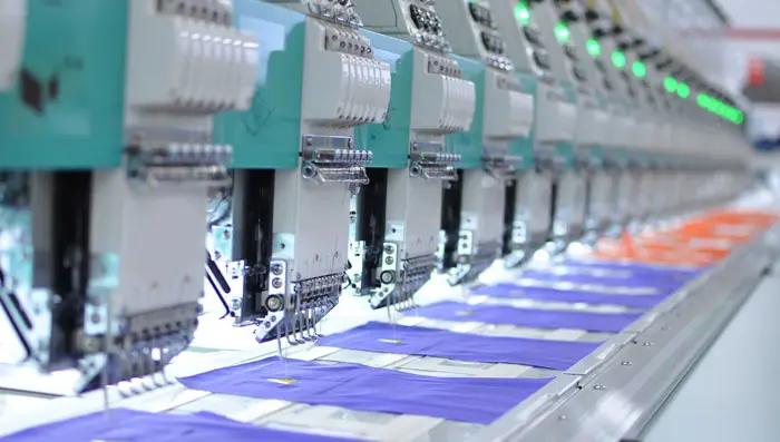 Industrial sewing machines in a manufacturing facility