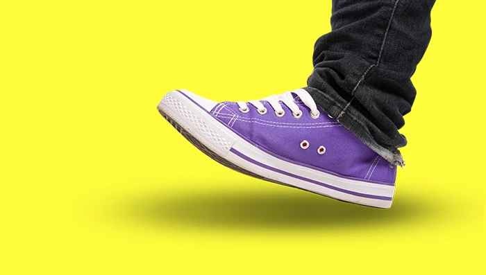 Purple shoe on yellow background