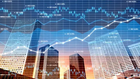 Candle stick charts and line graphs across skyline with buildings