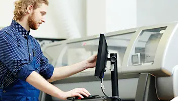 Man working on desktop.