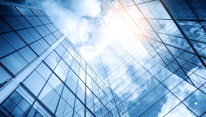 Glass buildings seen from underneath.