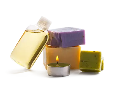A pile of soap bars and a tea light candle