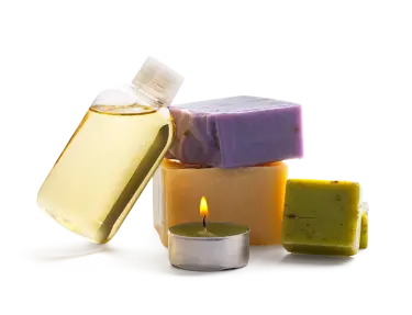 A pile of soap bars and a tea light candle