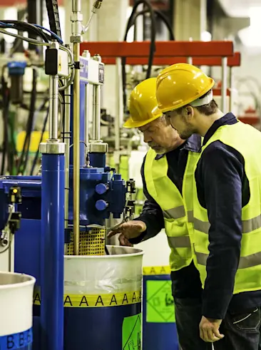 Workers checking chemicals