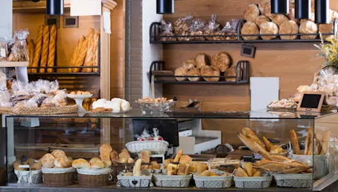 A wide array of baked goods on display in a storefront.