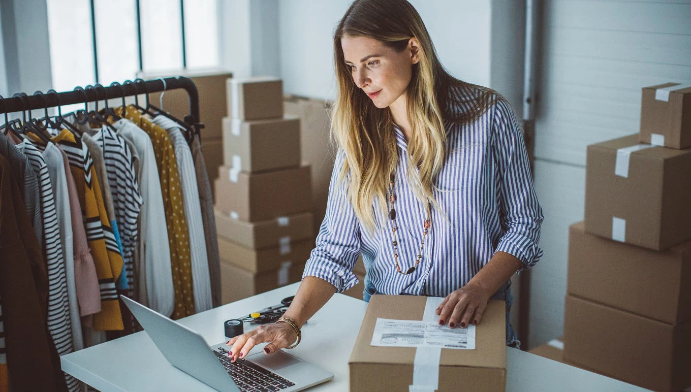 Preparing to shipping package with laptop on desk