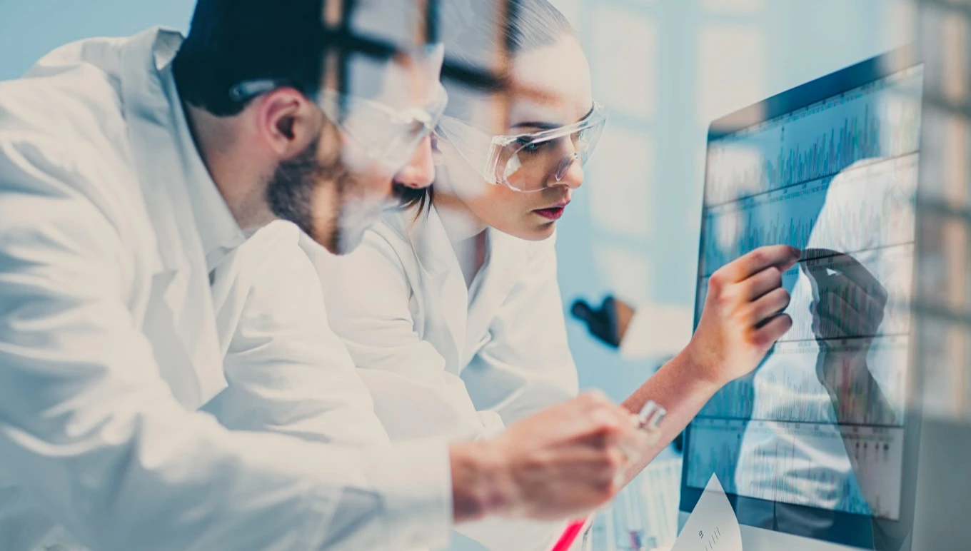 man and woman reviewing data