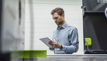 man reading tablet