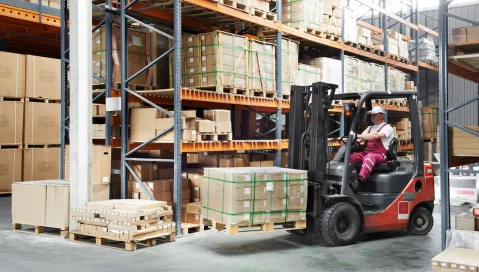 Man on forklift in warehouse