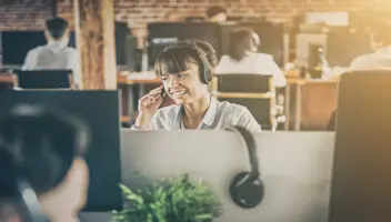 Woman on headset in call center