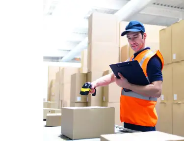 RF scanning a box in a warehouse.
