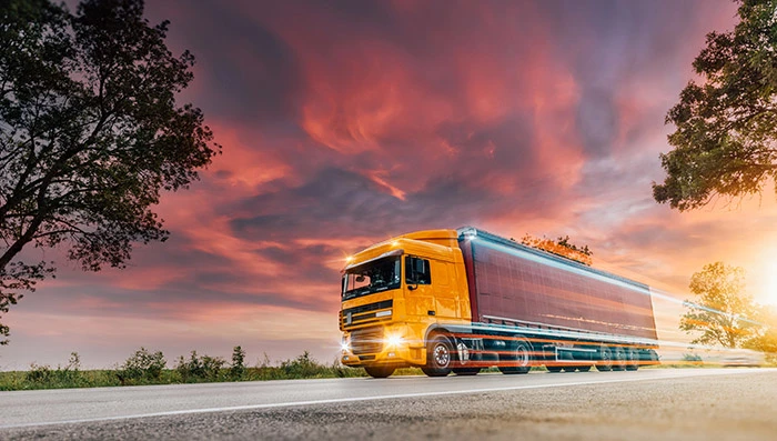 Orange truck on highway