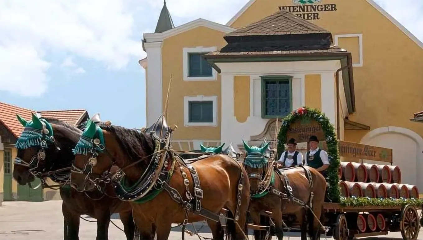 Wieninger Bier - horses pulling a wagon with barrels.