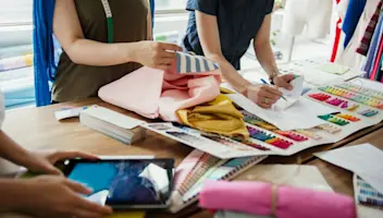 Employees working in a textile design workshop