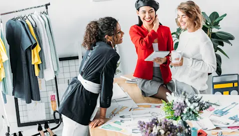 3 Women smiling having a conversation