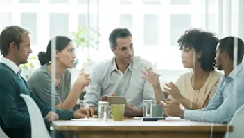 Food business decision-makers discuss strategy.