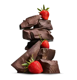 Stacked fudge blocks with strawberries.