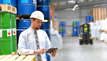 Man in warehouse using a tablet