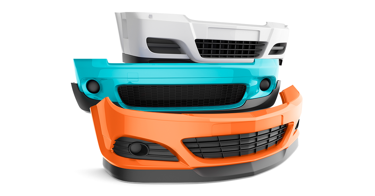 Stack of car front bumpers.