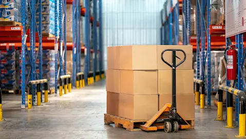 Boxes stack on pallet in warehouse