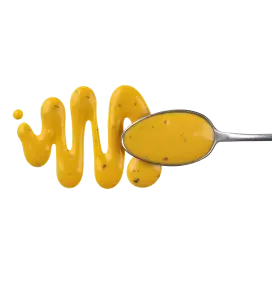Yellow sauce on a spoon