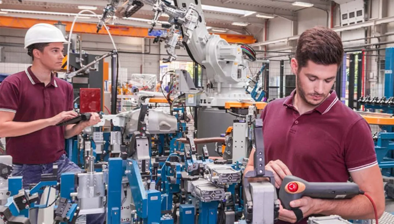 Zwei Männer mit einer elektrischen Maschine