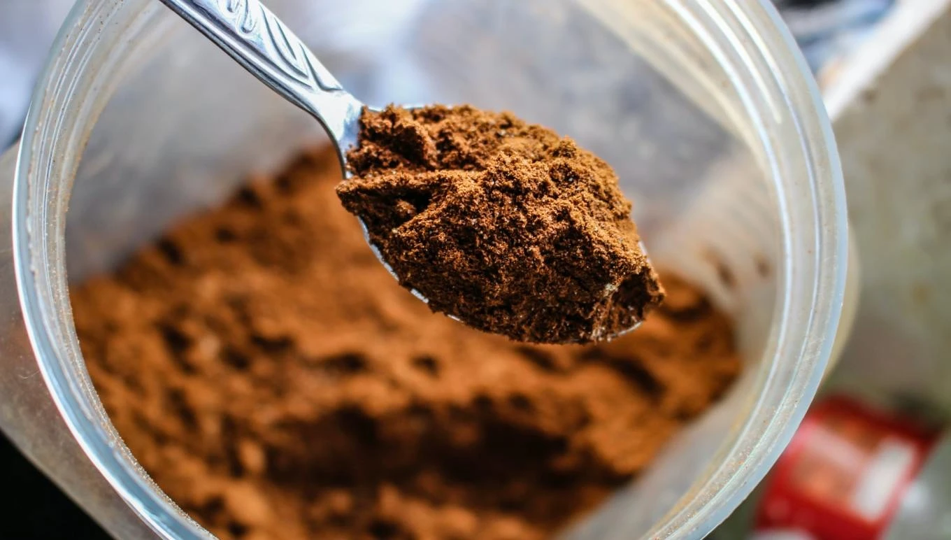 Ground coffee on a spoon