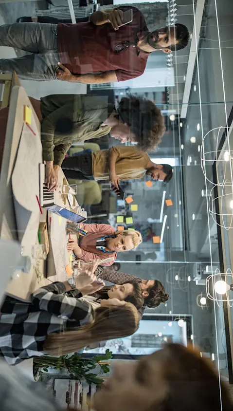Office workers meeting around table without social distancing