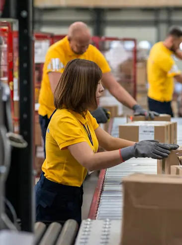 People working in a factory line.