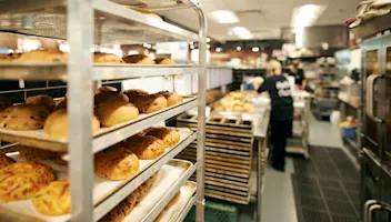 Freshly baked bread cools on a rack