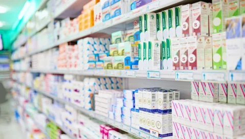 Pharmacy aisle with product on shelves