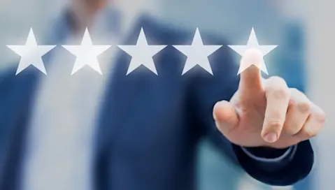 Man clicking 5 stars.