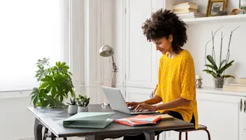 Woman working on her laptop.