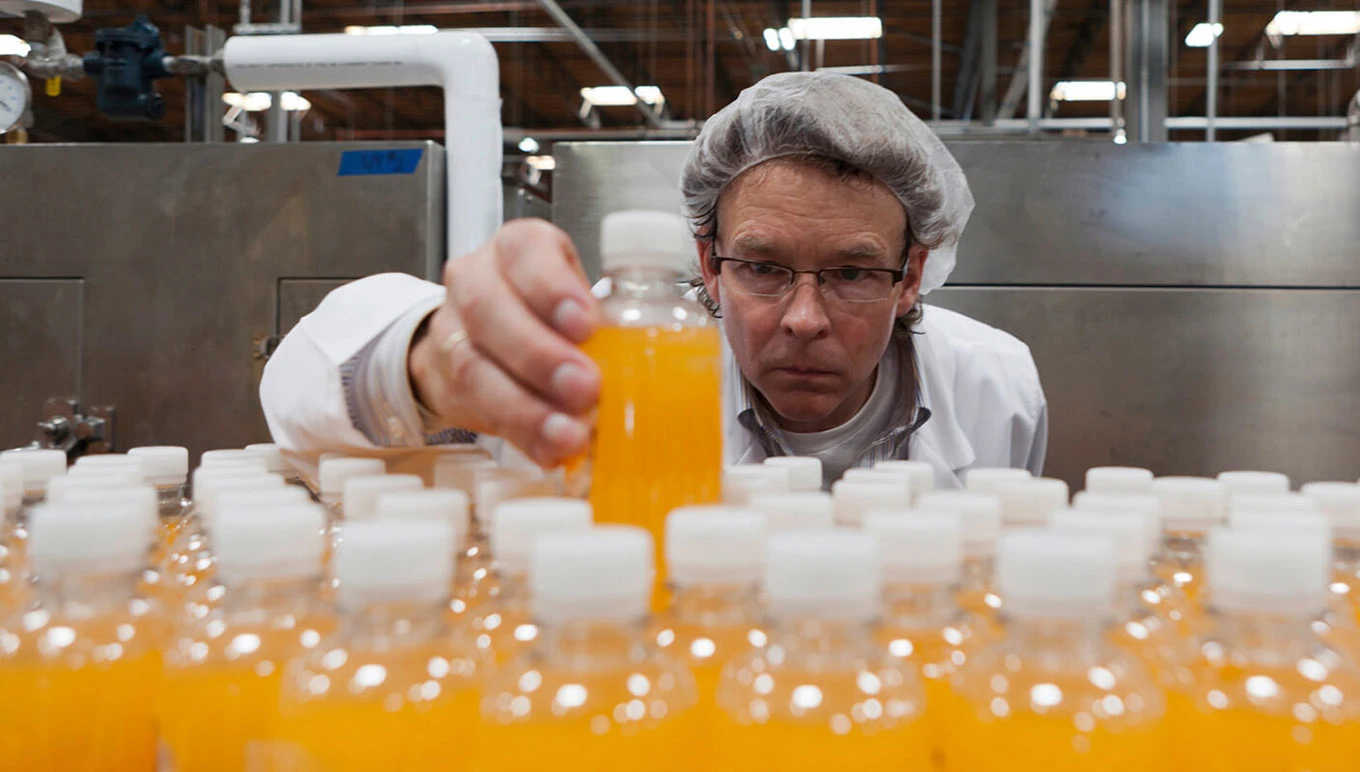 Worker examining bottling