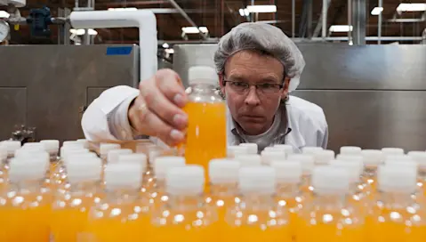 Worker examining bottling