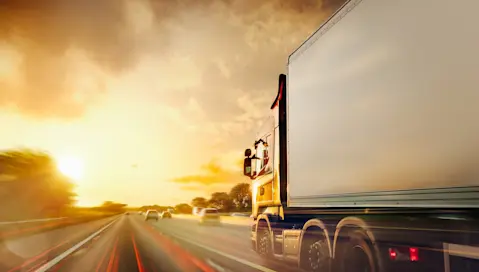 Truck driving on busy road