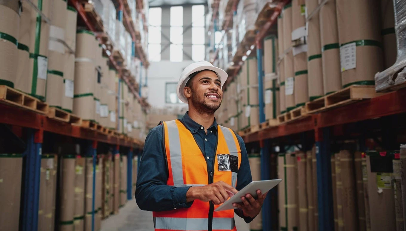 man in factory with tablet