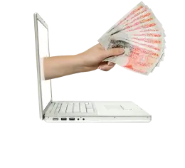 Hand with currency in laptop