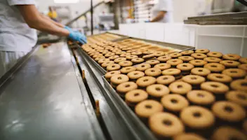 Cookies roll down a conveyer.