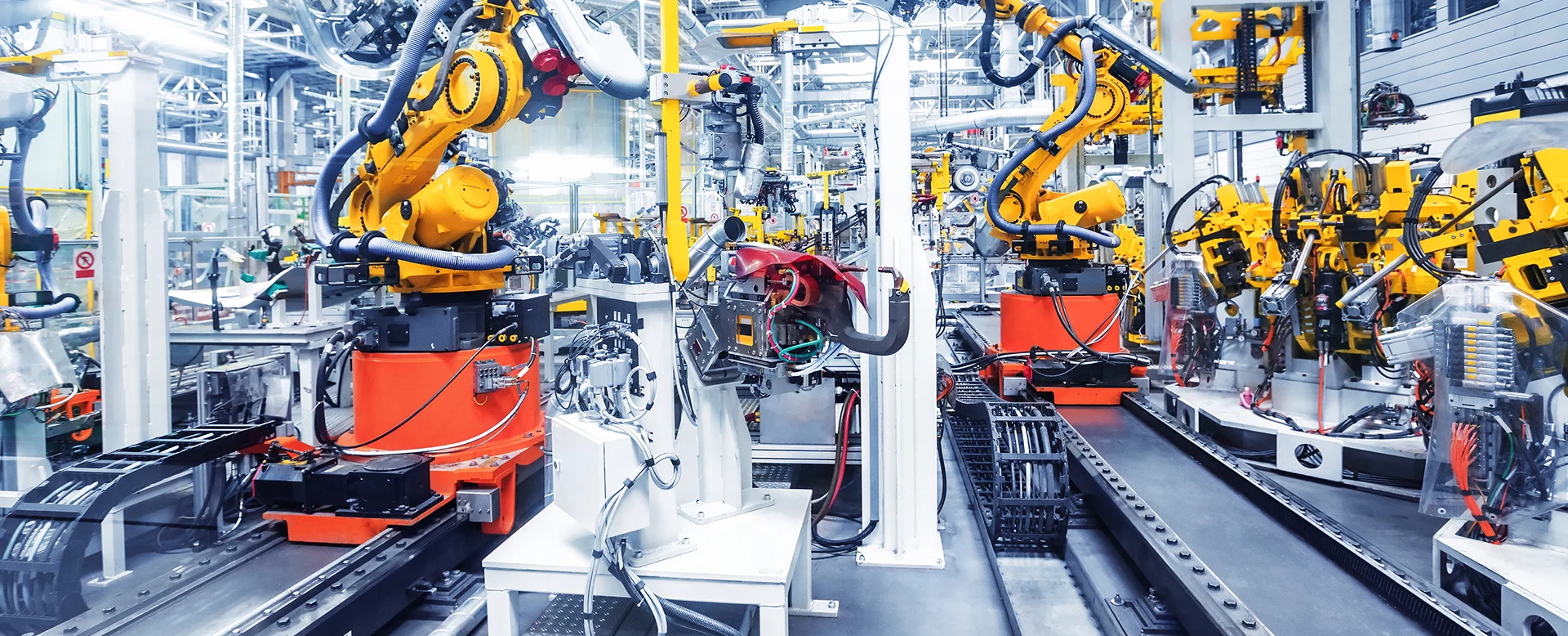 Robotic arms operating on an automotive production line