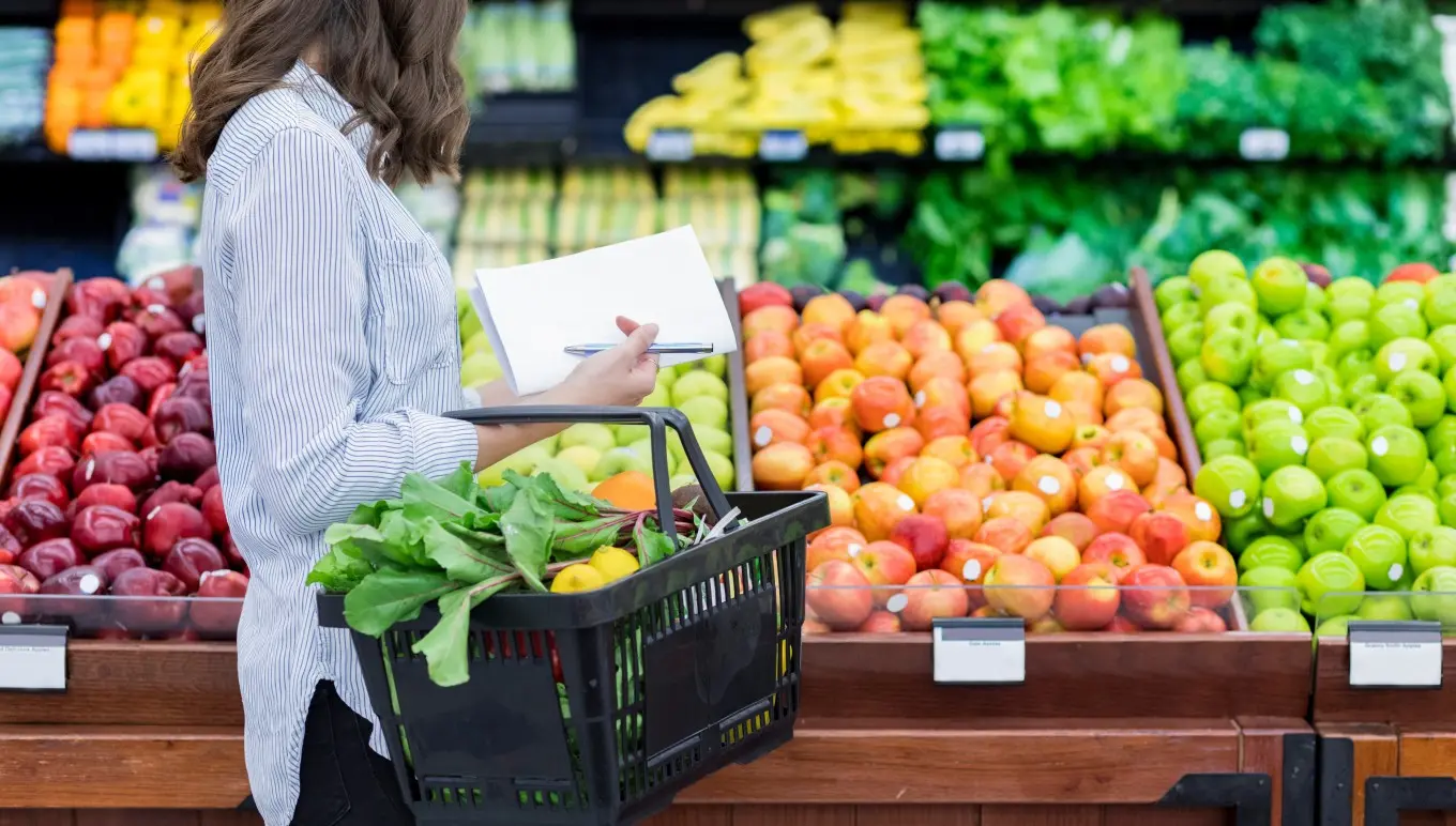 Person shopping for groceries in supermarket