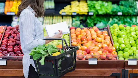 Person shopping for groceries in supermarket