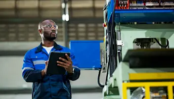 Worker doing checks with a clipboard